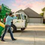 Residential Customer with Waste Management Recycling Bin and Waste & Recycling Pickup Truck